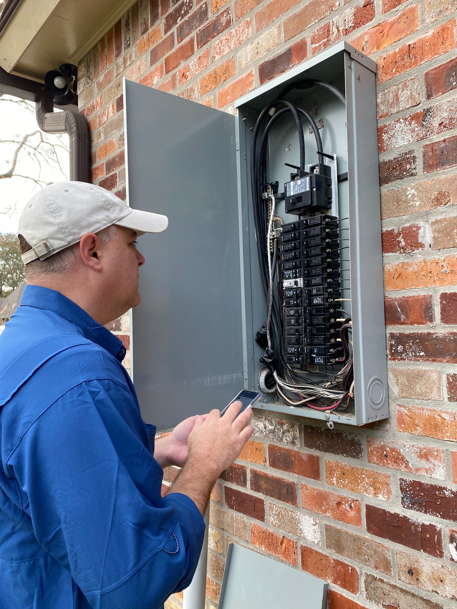 Ryan inspecting an electrical panel