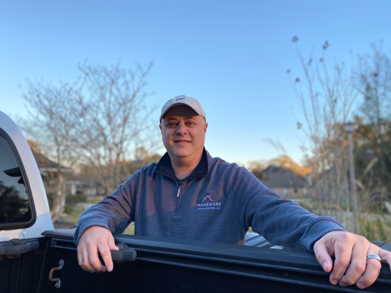 Ryan McNabb beside his Framework Home Inspection truck